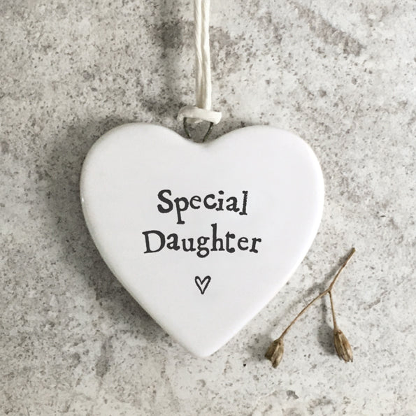 Heart-shaped hanging ornament with 'Special Daughter' text on a textured surface
